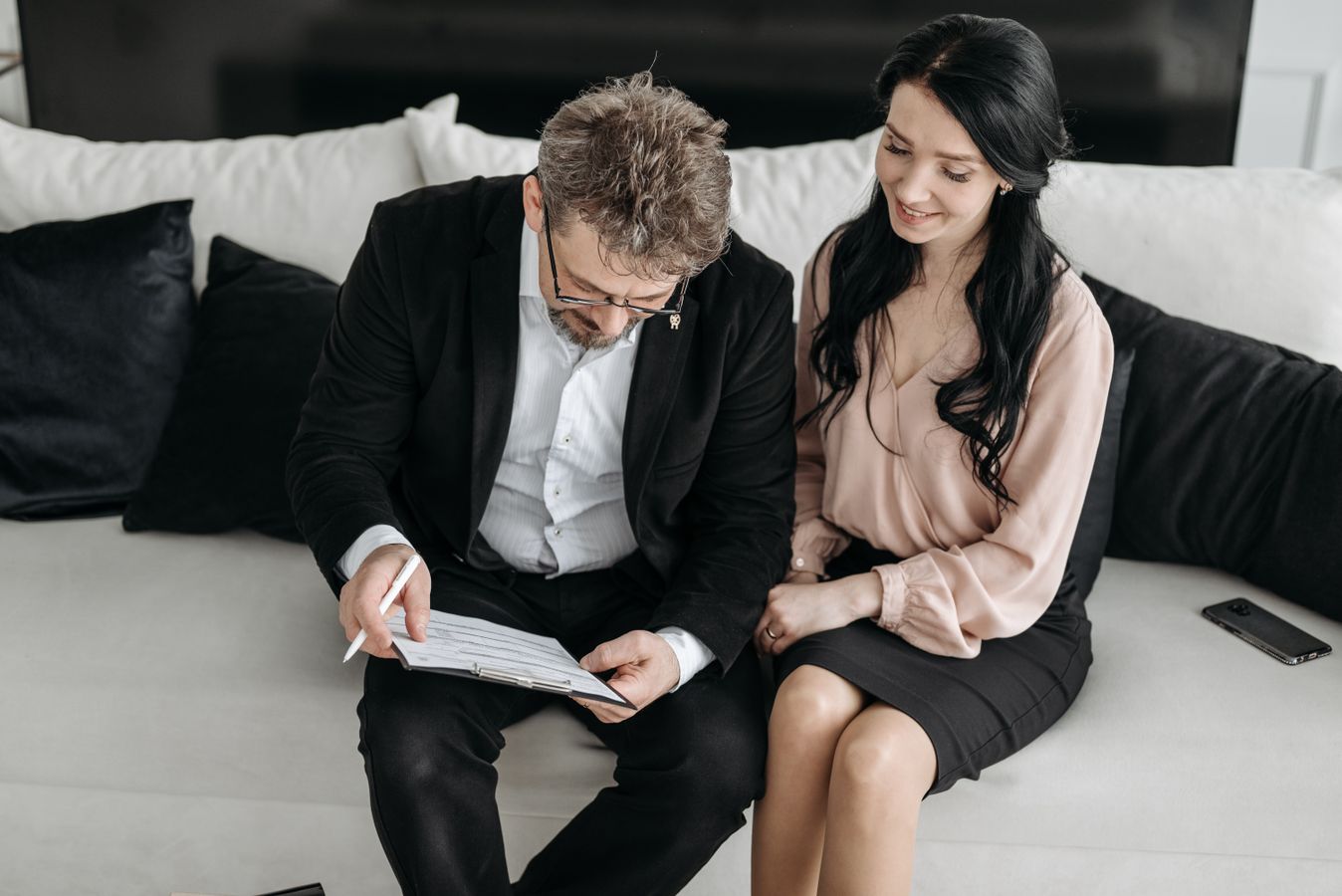 Business owners reviewing planning documents together