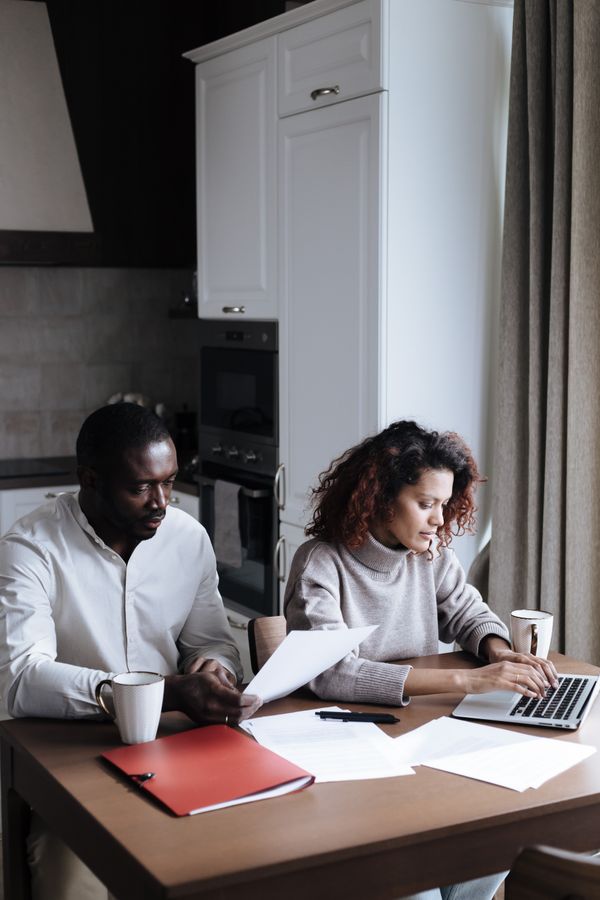 Couple reviewing important documents together at home